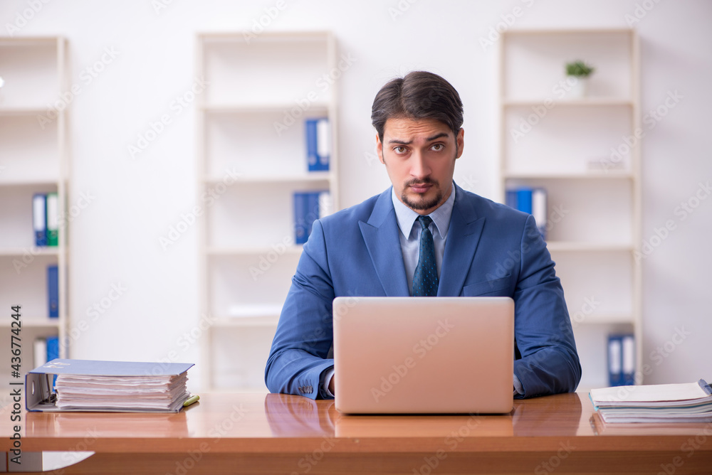 Young businessman employee working in the office Young businessman employee working in the office