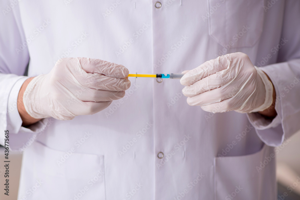 Young male doctor in vaccination concept Young male doctor in vaccination concept