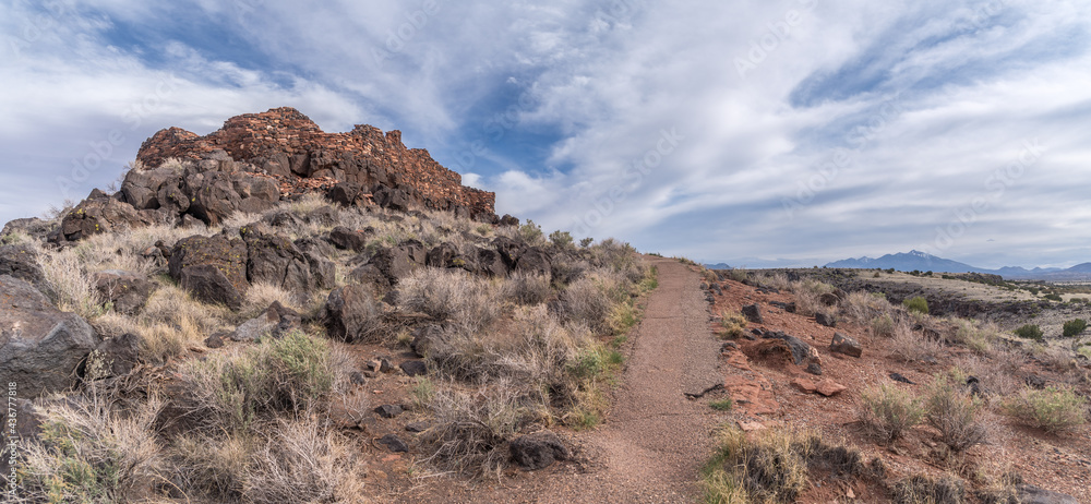 Wupatki Citadel National Monument located in north-central Arizona, . Native American archaeological hilltop dwelling sites made from red stone built by ancient Sinagua pueblo people, blue sky