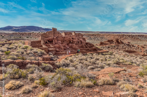 Wupatki National Monument located in north-central Arizona, near Flagstaff. Native American archaeological hilltop dwelling sites made from red stone built by ancient Sinagua pueblo people, blue sky