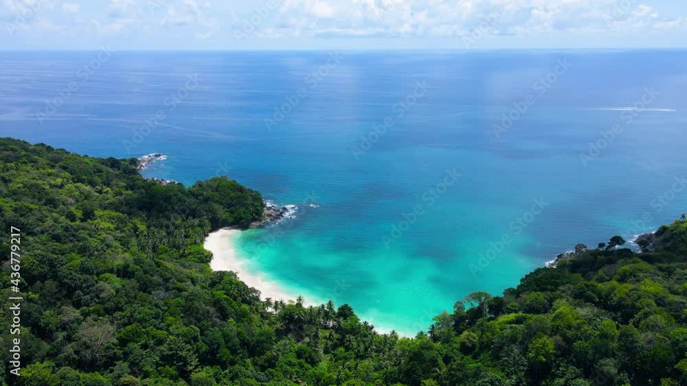 Professional Video 4K. Aerial view shot. Drone camera over white beach sand and sew water clear. Nature video view of beautiful tropical beach and yacht at sea. Freedom beach. At Phuket, Thailand. Professional Video 4K. Aerial view shot. Drone camera over white beach sand and sew water clear. Nature video view of beautiful tropical beach and yacht at sea. Freedom beach. At Phuket, Thailand.