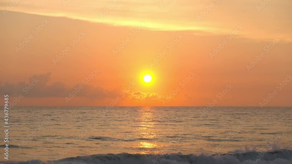 Professional 4K Video. Scene of Sunset on tropical beach sea. No people at beach. Phuket Thailand beautiful tropical beach with a sunset sky. Beautiful Phuket beach in Andaman sea sunset.