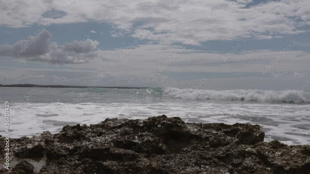 Rocky Shore With Crashing Sea Waves In Cloudscape Sky In Mediterranean Sardinia Island, Italy. - Zoom In Rocky Shore With Crashing Sea Waves In Cloudscape Sky In Mediterranean Sardinia Island, Italy. - Zoom In