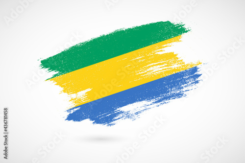 Happy independence day of Gabon with vintage style brush flag background