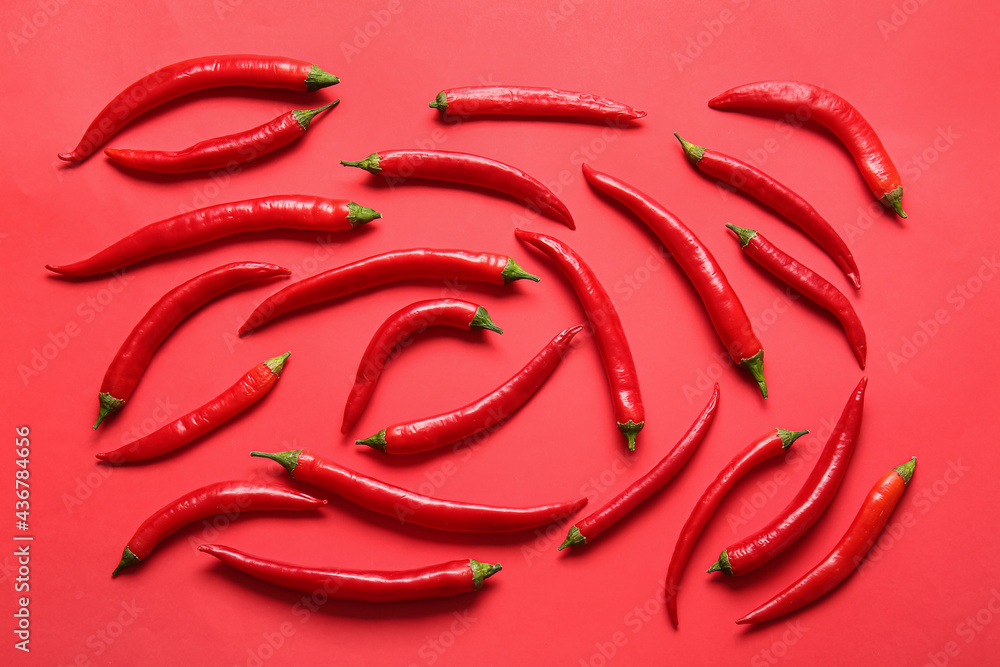 Hot chili peppers on color background Hot chili peppers on color background