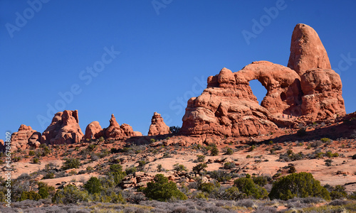 the eroded rock formation of  turret arch in arches national park on a sunny day near moab  utah 