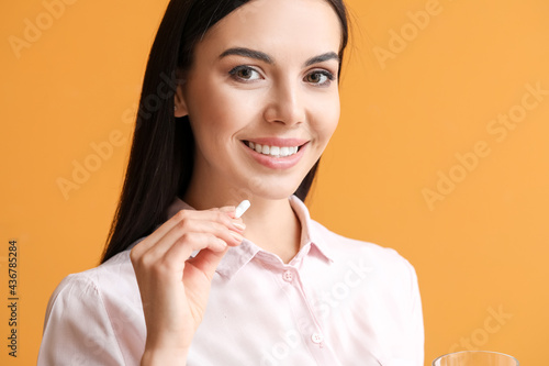 Beautiful young woman takin...