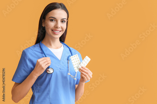 Female doctor with pills on...