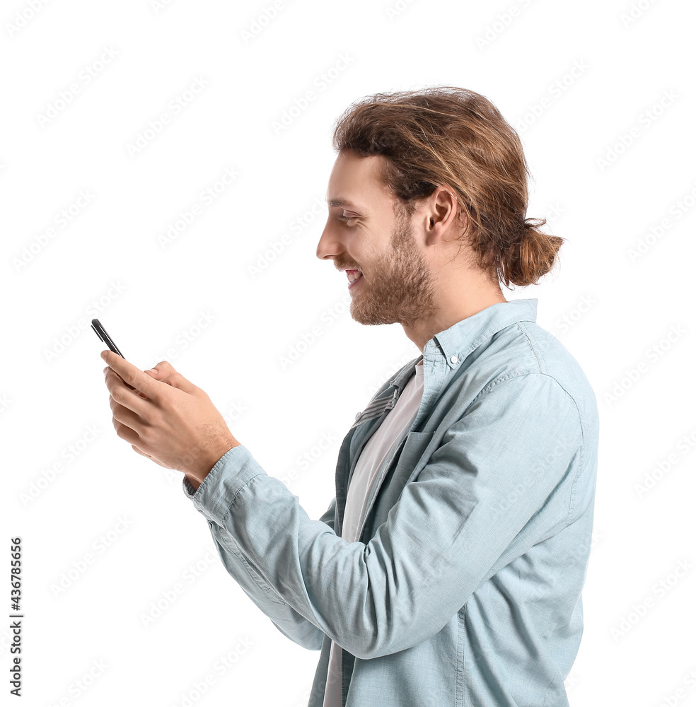 Handsome young man using mobile phone on white background Handsome young man using mobile phone on white background