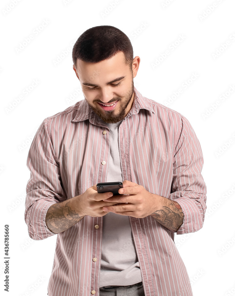 Handsome young man using mobile phone on white background Handsome young man using mobile phone on white background