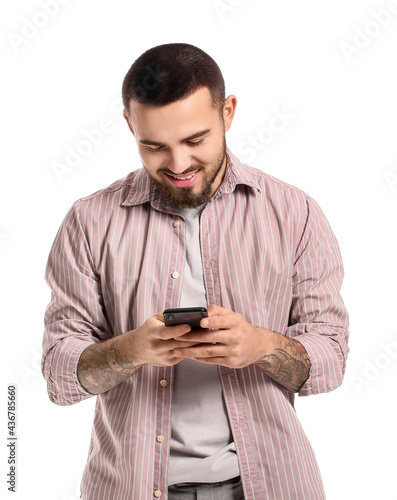 Handsome young man using mo...