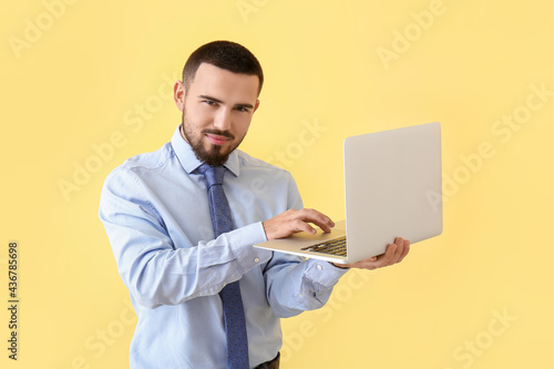 Young businessman using lap...