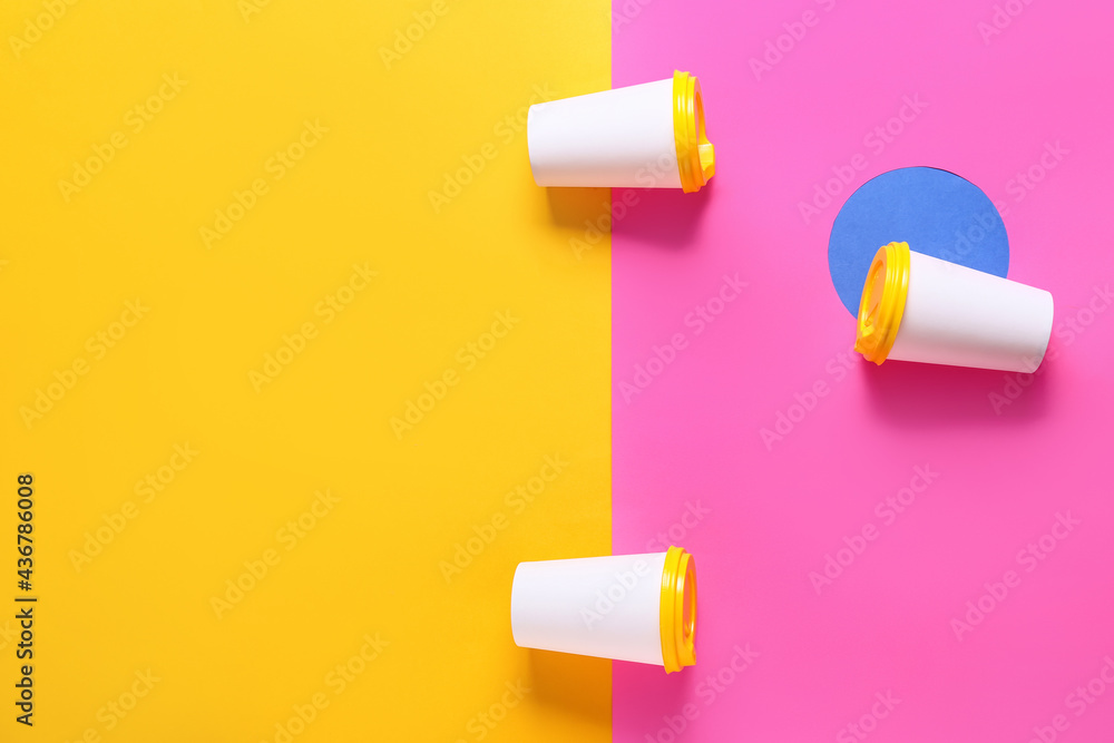 Blank paper cups on color background Blank paper cups on color background