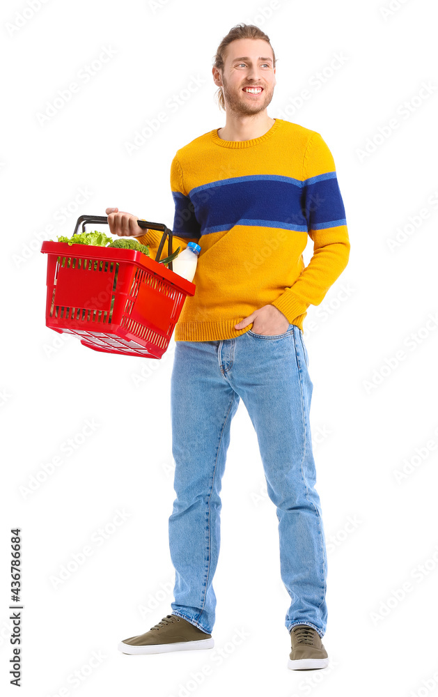 Young man with shopping basket on white background Young man with shopping basket on white background