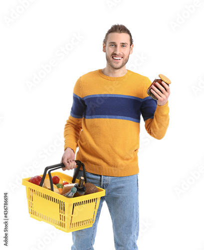 Smiling young man holding a...