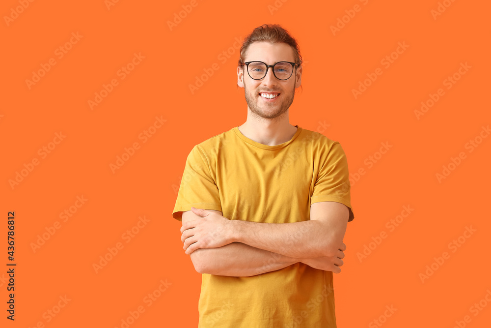 Young man wearing eyeglasses on color background Young man wearing eyeglasses on color background