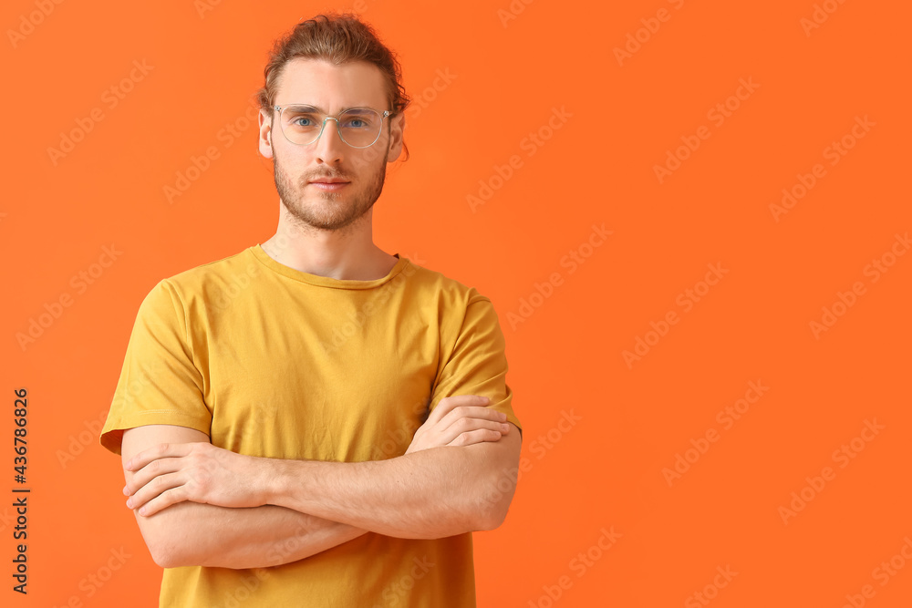Young man wearing eyeglasses on color background Young man wearing eyeglasses on color background