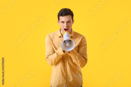 Young man with megaphone on...