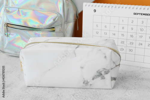 Pencil case and backpack on...