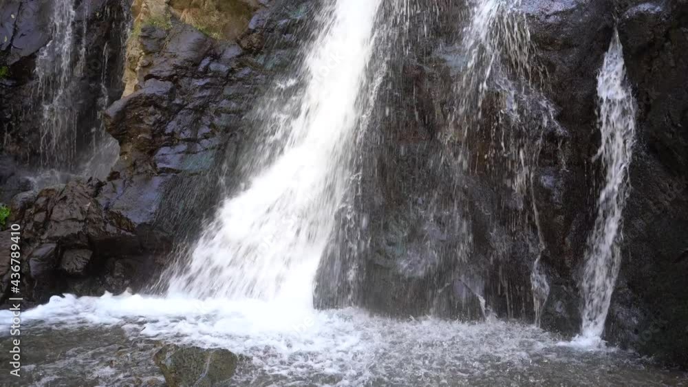 Waterfall falling from Atlas mountain on rocky surface in Morocco - static medium steady shot Waterfall falling from Atlas mountain on rocky surface in Morocco - static medium steady shot