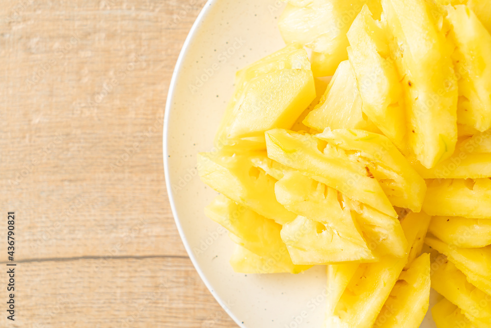 fresh pineapple sliced on plate fresh pineapple sliced on plate