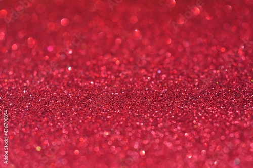 Red glittering bokeh lights on blur background