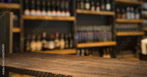 wood table on blur of cafe, coffee shop, bar, background - can used for display or montage your products © kishivan