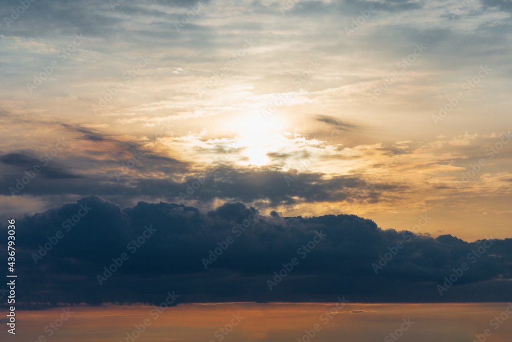 Dramatic sunset sky with clouds.Sunset or sunrise with clouds, light rays and atmospheric effect