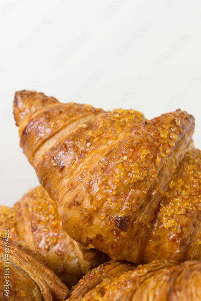 tasty croissants on white background. French food. Close up tasty croissants on white background. French food. Close up