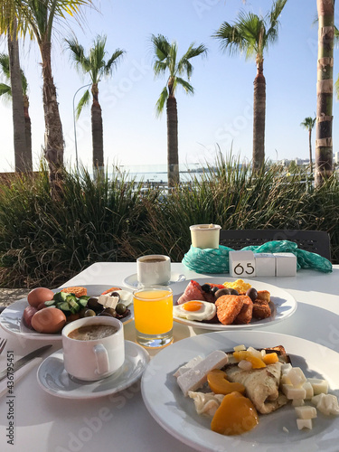 breakfast of scrambled eggs with bacon and coffee on the hotel's terrace on the seashore. Protaras. Ayia Napa. Cyprus.
