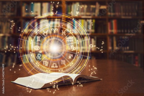 фотографія Horoscope astrology, Zodiac sign and constellation study for foretell and fortune telling education course concept with horoscopic wheel over old book in school library