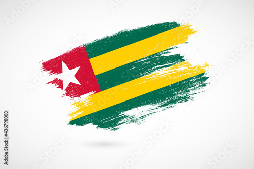Happy independence day of Togo with vintage style brush flag background