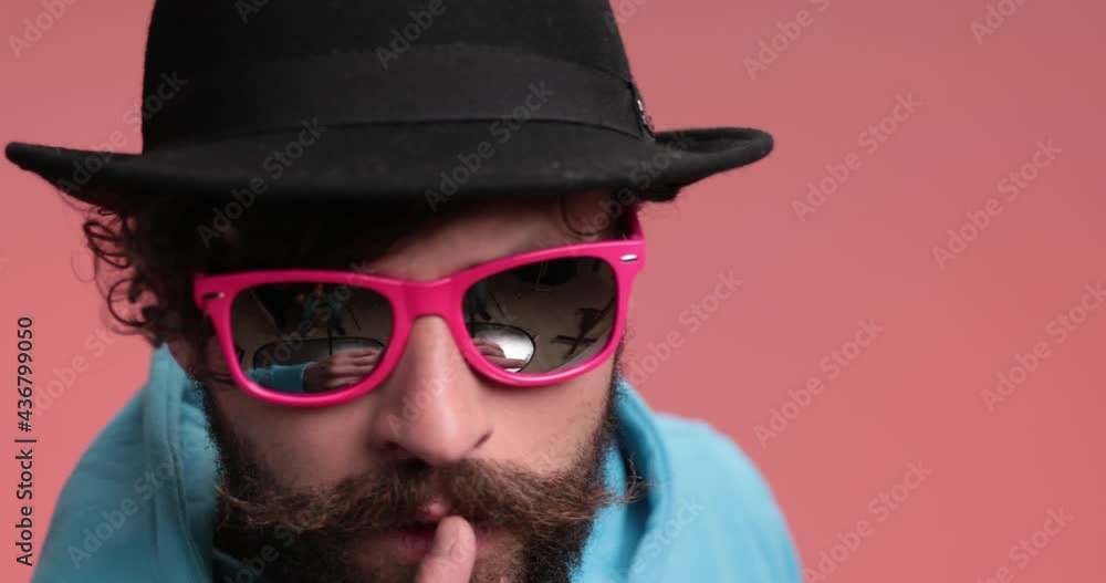 sexy casual man asking for silence and slapping the camera sexy casual man asking for silence and slapping the camera