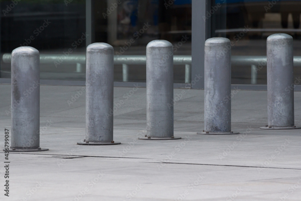 Stainless Steel bollards on concrete pavement. Stainless Steel bollards on concrete pavement.