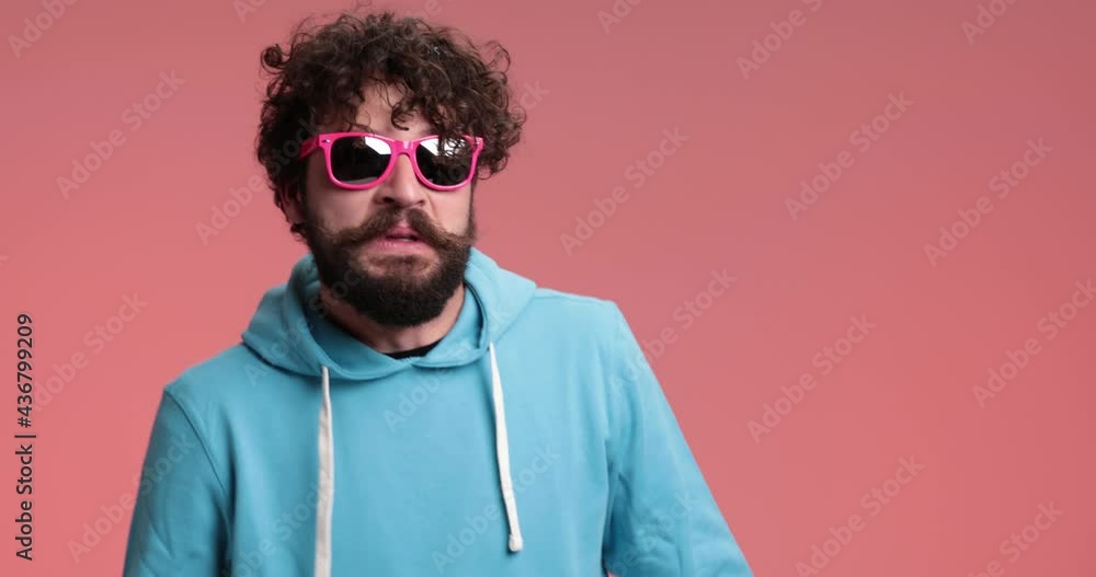 attractive casual guy stepping from one foot to another, feeling agitated, having no clue, justifying himself, gesturing a mad sign attractive casual guy stepping from one foot to another, feeling agitated, having no clue, justifying himself, gesturing a mad sign