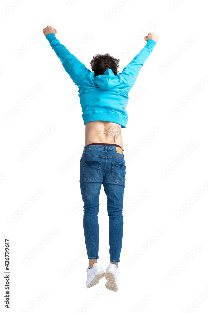 back view of casual man in blue hoodie jumping in the air back view of casual man in blue hoodie jumping in the air