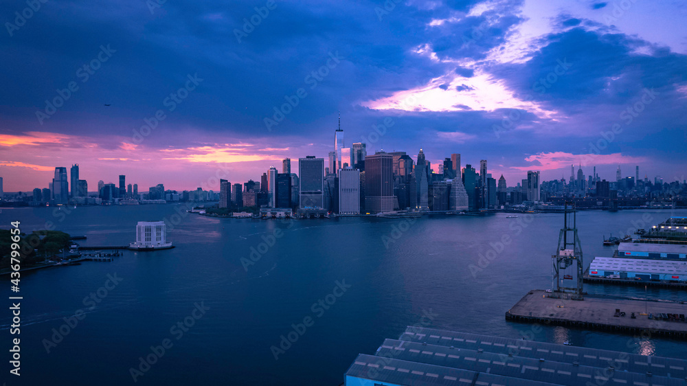 Skyline of Manhattan Durning amazing Sunset with top of the Line Drone 