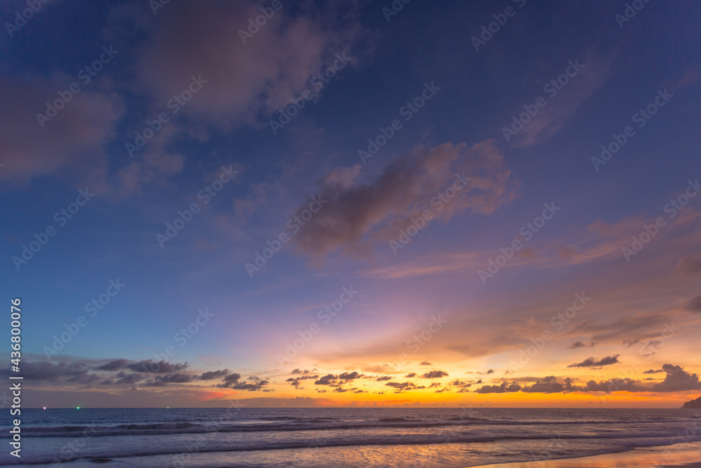 Fototapeta premium Majestic sunset or sunrise landscape Amazing light of nature cloudscape sky and Clouds moving away rolling .Beautiful Phuket beach is a famous tourist destination in Andaman sea summer. 
