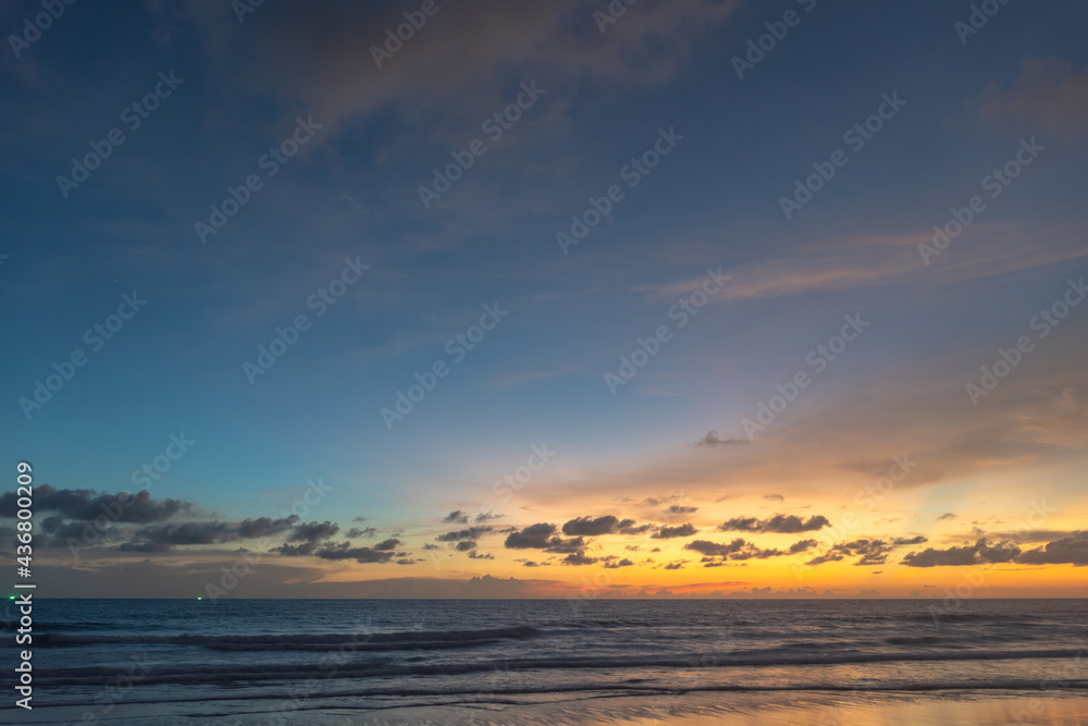 Majestic sunset or sunrise landscape Amazing light of nature cloudscape sky and Clouds moving away rolling .Beautiful Phuket beach is a famous tourist destination in Andaman sea summer. .