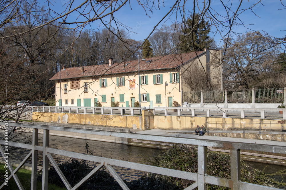 Obraz premium Robecco sul Naviglio ( MI ), Italy - April 01, 2021: Robecco sul Naviglio town and Naviglio Grande, Milano, Lombardy, Italy