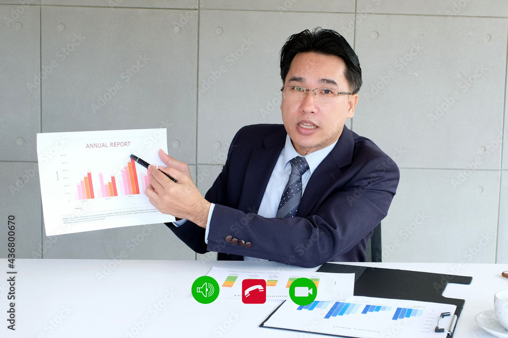Video conference, Work from home, Asian man making video call to business team with virtual web, Contacting asia colleagues group by conference , Coworker talking on web, Online consultation business Video conference, Work from home, Asian man making video call to business team with virtual web, Contacting asia colleagues group by conference , Coworker talking on web, Online consultation business