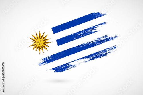 Happy independence day of Uruguay with vintage style brush flag background photo