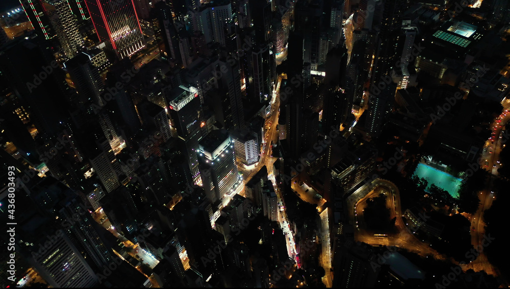 AERIAL. Top view of Hong Kong city at night time. AERIAL. Top view of Hong Kong city at night time.