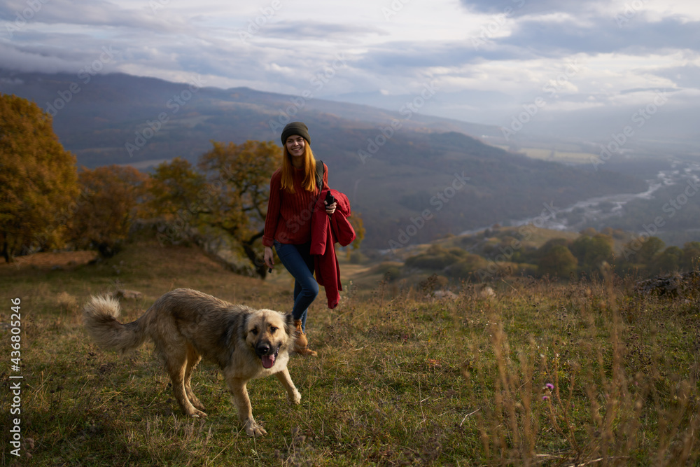 women walking next to the dog in nature landscape mountains travel