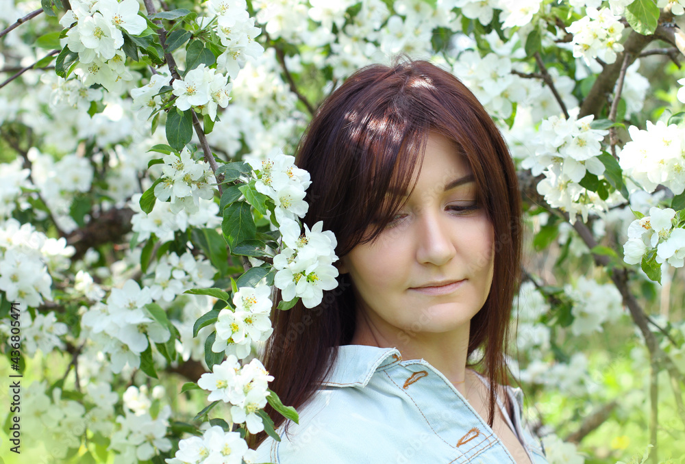 Beautiful woman with cherry flowers in spring garden Beautiful woman with cherry flowers in spring garden