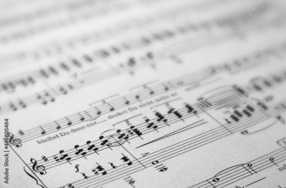Close up of music notes. Blurred dreamy and sharp areas. Black and white photo. Close up of music notes. Blurred dreamy and sharp areas. Black and white photo.