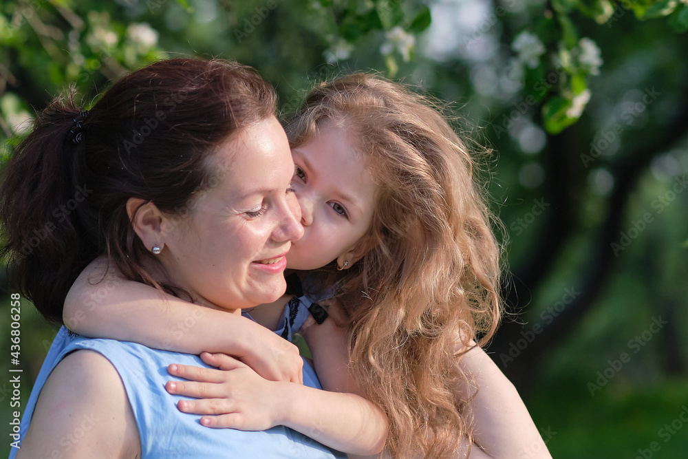 nature scene with family outdoor lifestyle. Mother and little daughter playing together in a park. Happy family concept. Happiness and harmony in family life. nature scene with family outdoor lifestyle. Mother and little daughter playing together in a park. Happy family concept. Happiness and harmony in family life.