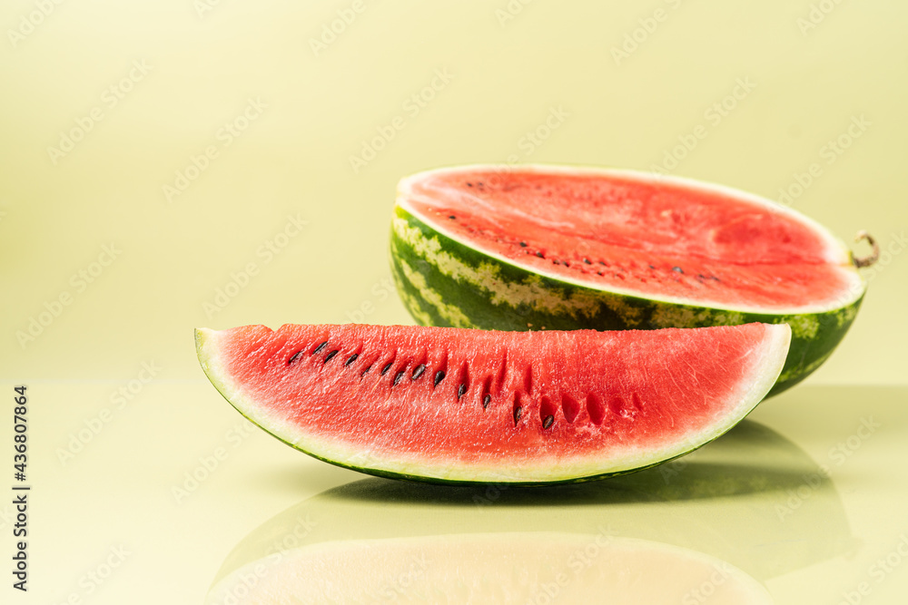 Juicy ripe fresh piece of watermelon. Summer pastel green background, side view Juicy ripe fresh piece of watermelon. Summer pastel green background, side view