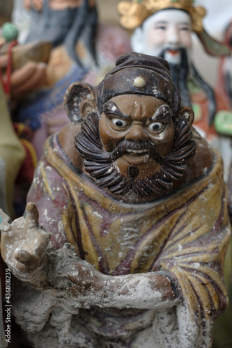 Abandoned ceramic statue photographed in Wah Kwai shrine in Aberdeen, Southern Hong Kong. In the old days, people didn't want to throw away the statues they'd had at and so the shrine was born. © Danil Rogulin