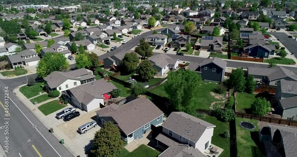 A drone pulls a left dolly shot of a beautiful neighborhood. A drone pulls a left dolly shot of a beautiful neighborhood.